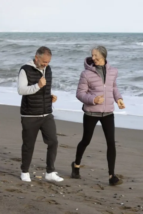Ankle & Foot Centers of America — couple walking on the beach